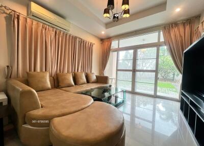 Spacious and well-lit living room with garden view