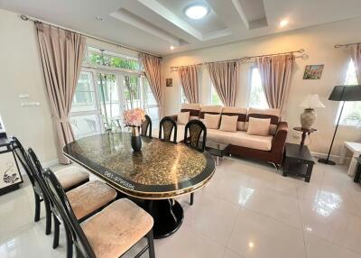 Elegantly furnished living room with dining area