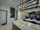 Modern kitchen with marble countertops and integrated living space