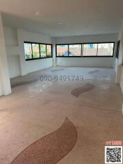 Spacious empty living room with large windows