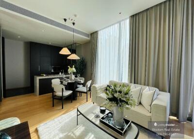 Elegant modern living room with open kitchen design