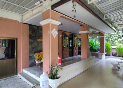 Spacious covered patio with artistic decor and ample seating