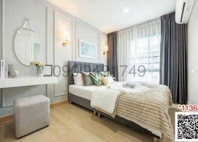 Modern bedroom with stylish decor and abundant natural light