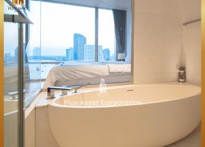 Modern bathroom with bathtub and city view