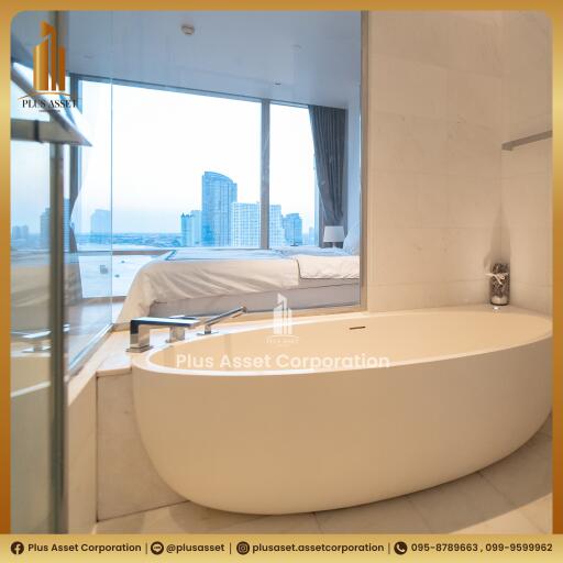 Modern bathroom with bathtub and city view