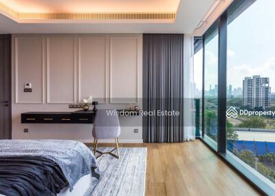 Modern bedroom with expansive windows and city view