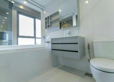 Modern bathroom with large window and minimalist design