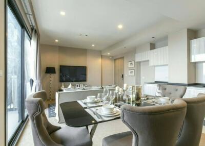 Modern and spacious living room with dining area and open kitchen
