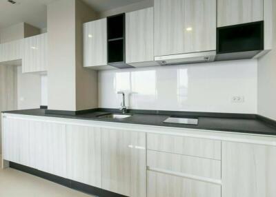 Modern minimalist kitchen with white cabinetry and sleek design
