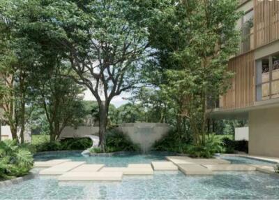 Tranquil communal garden with water feature in residential building complex
