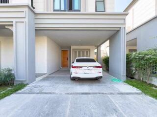 Modern home exterior with car parked in driveway