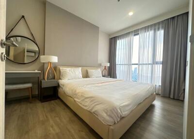 Well-appointed bedroom with large bed and modern furnishings