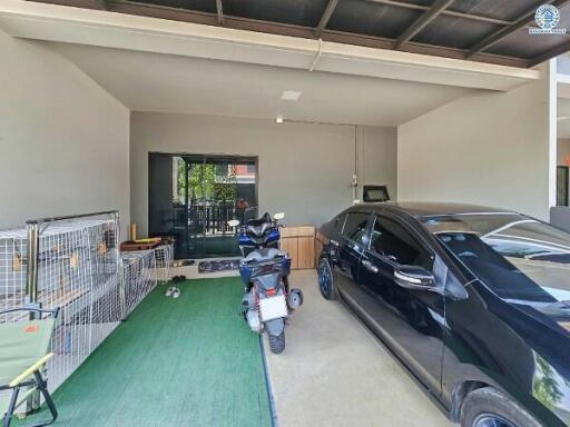 Spacious garage with vehicles and storage space