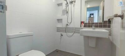 Modern bathroom with white interior and wall-mounted fixtures
