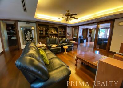 Spacious living room with elegant furniture and hardwood floors