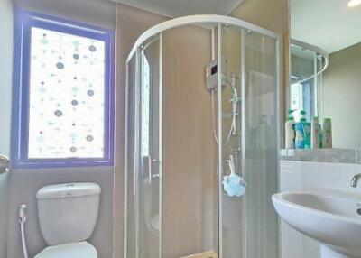 Modern bathroom with shower cabin and natural light