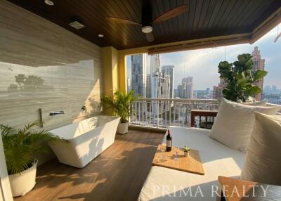 Modern balcony with comfortable seating, city view, and wooden flooring