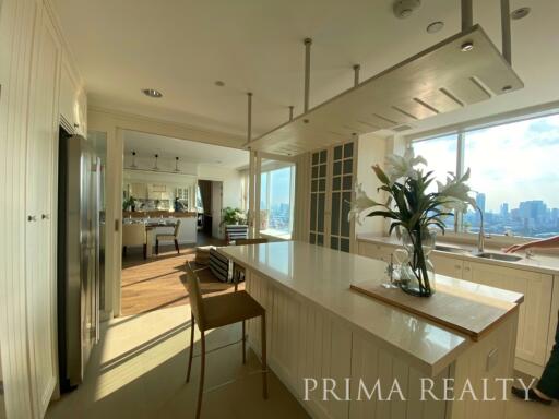 Spacious kitchen with modern appliances and city view