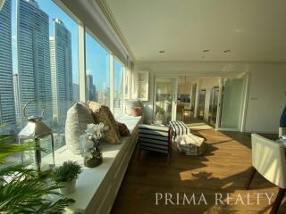 Modern sunlit living space with city skyline views