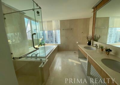 Spacious modern bathroom with large windows and city view