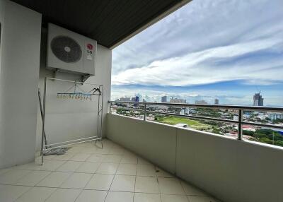 Spacious balcony with panoramic city view and air conditioning unit