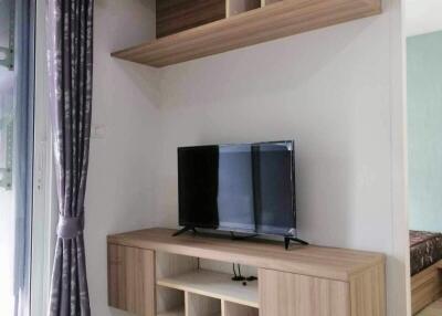 Modern living room interior with mounted shelves and television