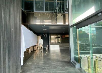 Spacious modern building interior with large windows and artistic design elements