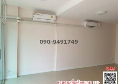 Spacious and bright empty room with air conditioners