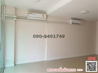 Spacious and bright empty room with air conditioners