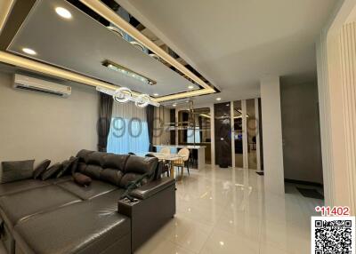 Modern living room with open plan leading to the dining area