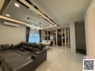 Modern living room with open plan leading to the dining area