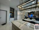 Modern kitchen with a wine refrigerator and elegant hanging lighting