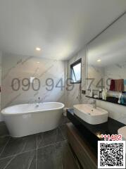 Modern bathroom with freestanding tub and large sink