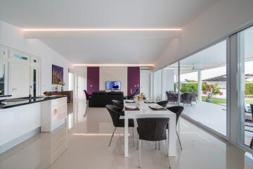 Modern open-plan living space with kitchen and dining area