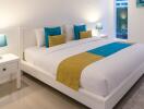 Bright and modern bedroom with a double bed and colorful accents