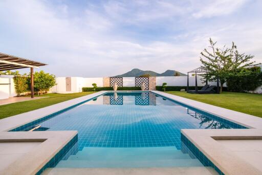 Swimming pool with mountain view and landscaped garden at luxury property