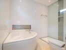 Bright modern bathroom with bathtub and elegant tiling