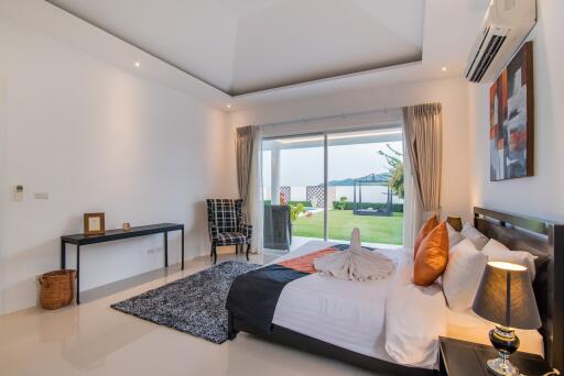 Spacious bedroom with modern decor and outdoor view