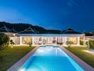 Luxurious house exterior with illuminated swimming pool at twilight