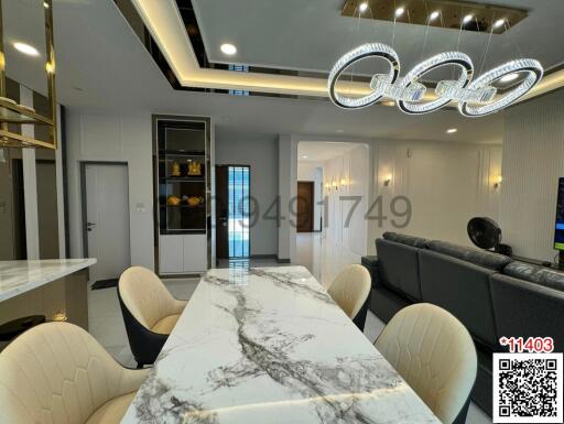 Modern dining room with elegant lighting and marble table
