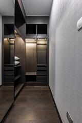 Modern hallway interior with dark wood finishes and stylish lighting