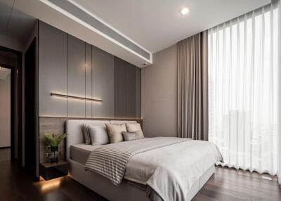 Modern bedroom with large window and elegant decor