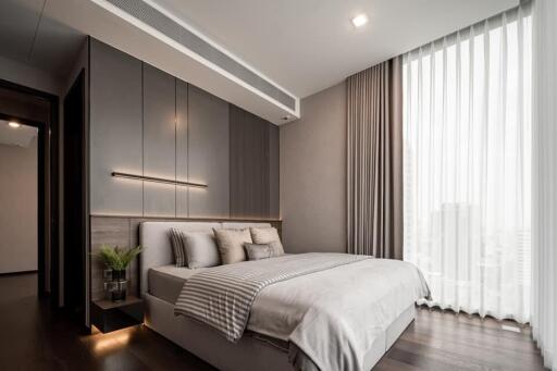 Modern bedroom with large window and elegant decor