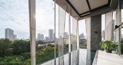 Modern balcony with glass barrier overlooking the city skyline