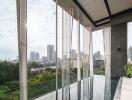 Modern balcony with glass barrier overlooking the city skyline