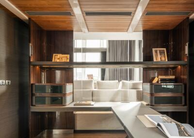 Modern living room interior with wooden finishes and ample sunlight