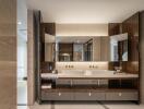Modern bathroom interior with dual sinks and wooden finishes