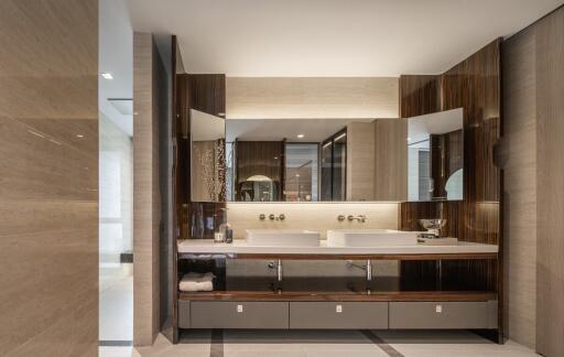 Modern bathroom interior with dual sinks and wooden finishes
