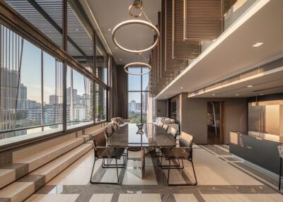 Modern living room with dining area and city view