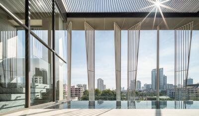 Modern balcony with cityscape view and glass railing